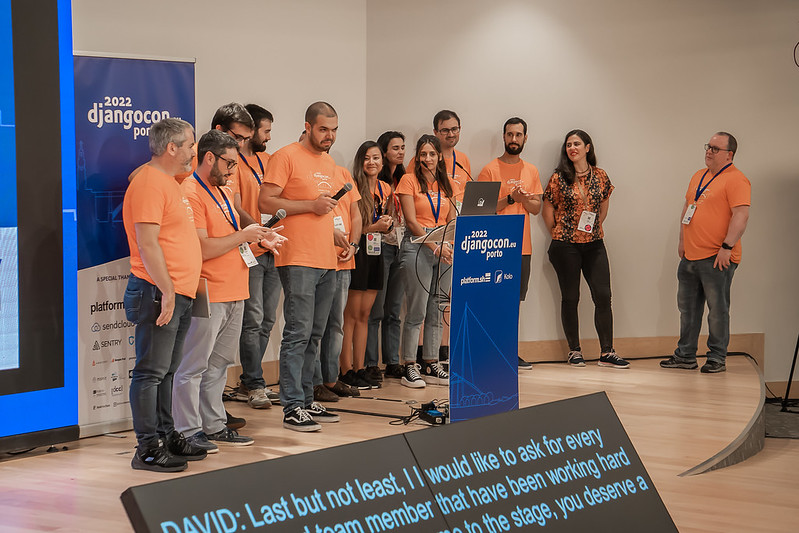 Volunteers on stage at DjangoCon Europe 2022 in Porto